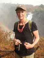 Here's an alt tag for the image: Woman hiker at Victoria Falls.